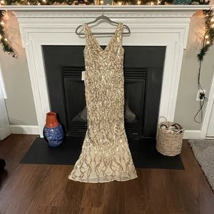 Beautiful fitted champagne colored gown.